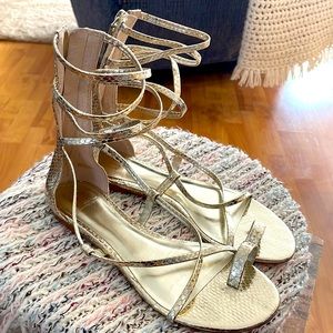 Gold gladiator sandals . J Lo brand